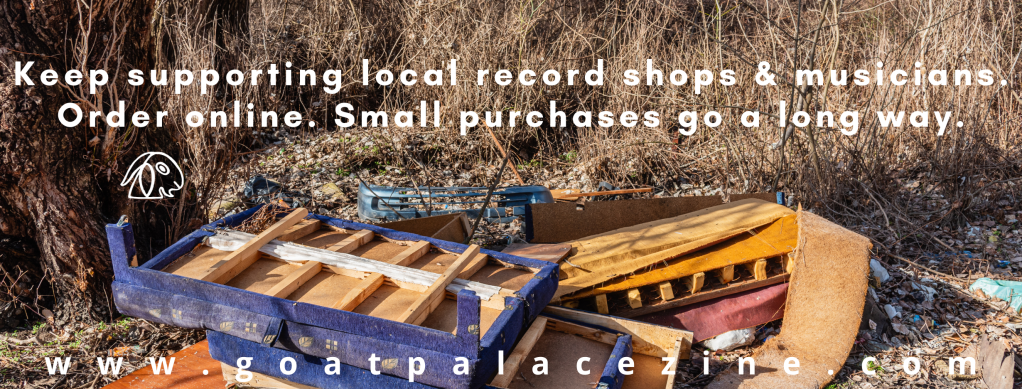 Pile of old furniture dumped in a forest.