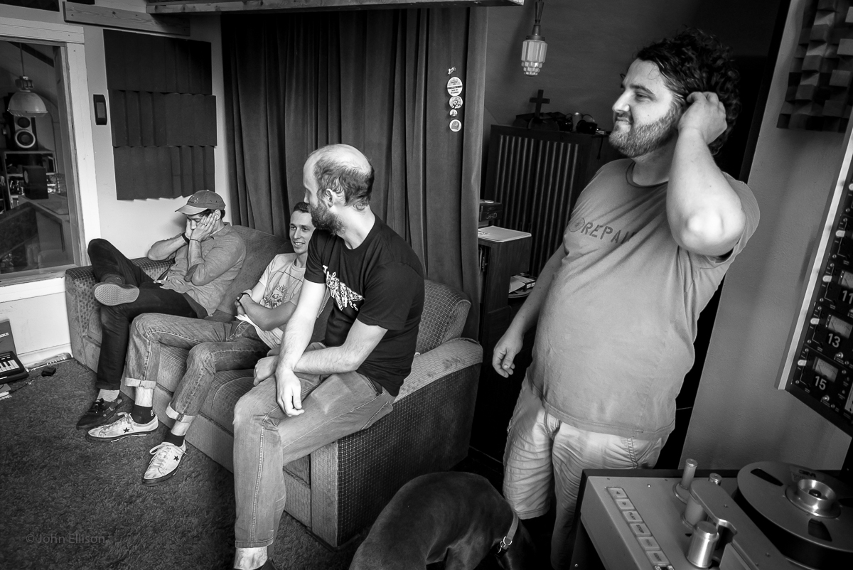 Buffet listening to playback in the Unknown Studio.