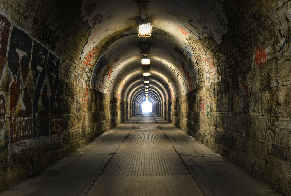 Dark tunnel with light at the end