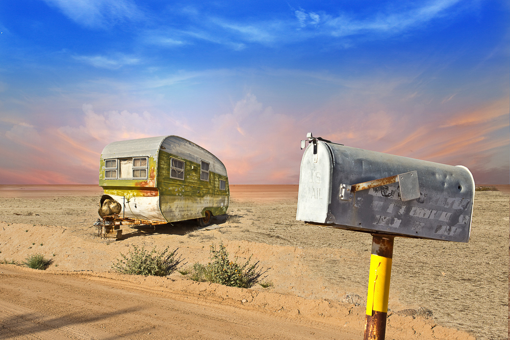 Old trailer with mailbox out front