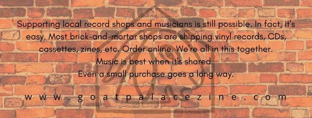 brick wall with Goat Palace logo