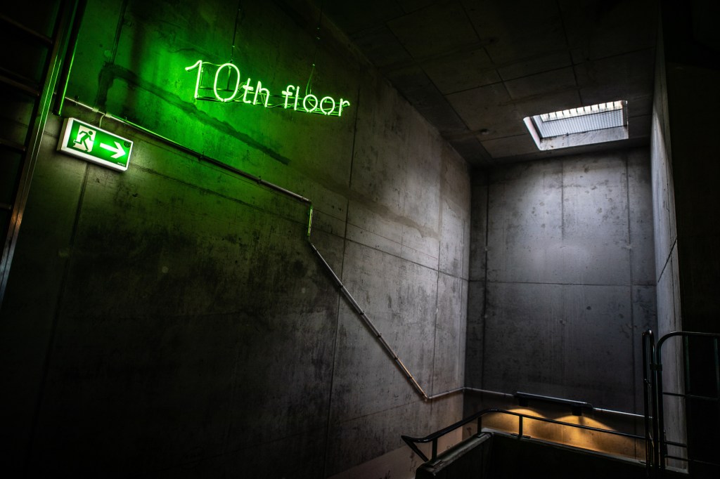 10th floor sign in a concrete stairwell