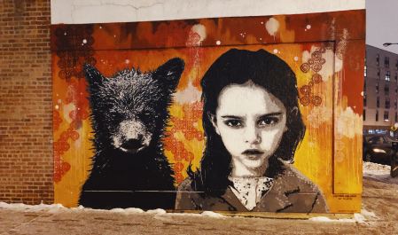 Graffiti of a bear cub and a child