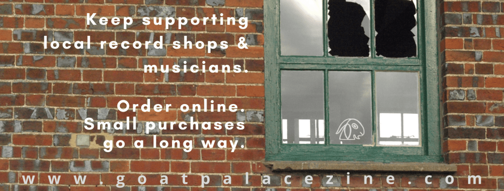 Brick wall with a broken window.