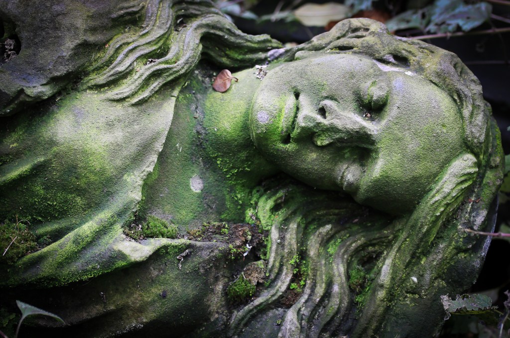 Old statue in a cemetery in Prague