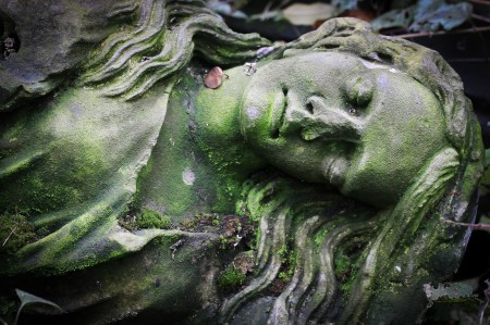 Old statue in a cemetery in Prague
