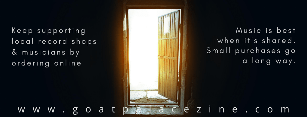 A door in a dark room opening into bright sunlight.