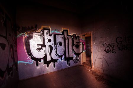 Abandoned house with graffiti walls.